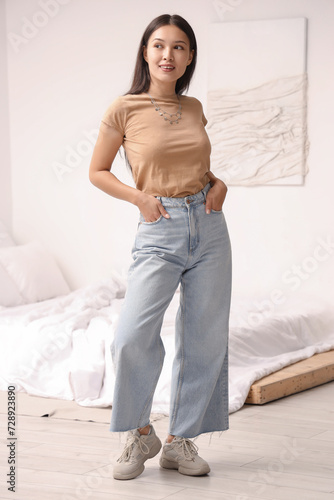 Young Asian woman wearing t...
