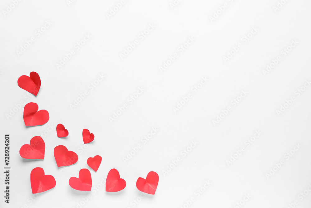 Composition with small paper hearts on light background. Valentines Day celebration