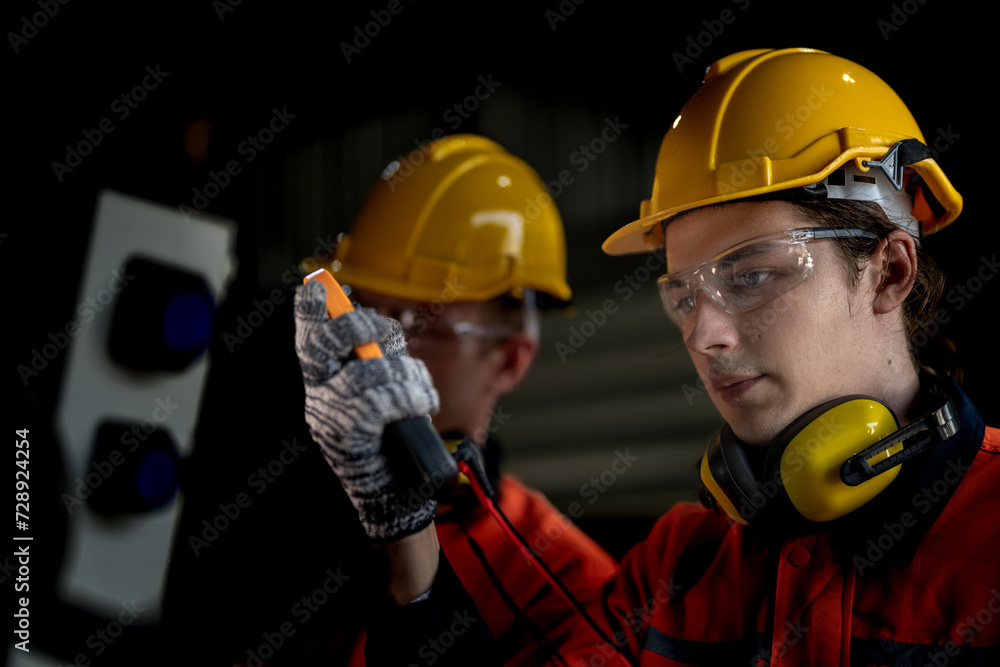 male engineer workers maintenance automatic robotic arm machine in a factory. worker checking and repairing automatic robot hand machine. technician worker check for repair factory machine. male engineer workers maintenance automatic robotic arm machine in a factory. worker checking and repairing automatic robot hand machine. technician worker check for repair factory machine.