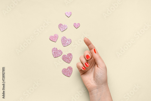 Female hand with red nail p...