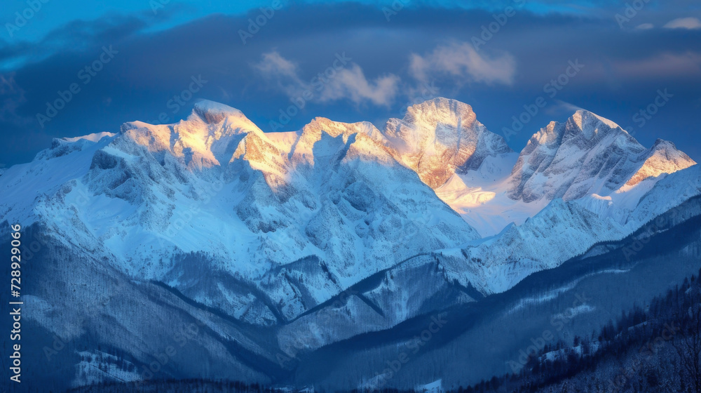 Against the backdrop of the evening sky the glistening snow peaks take on a romantic quality.