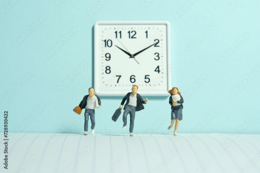 Miniature tiny people toy photography. A group of pupils running in the school hallway, late for class Miniature tiny people toy photography. A group of pupils running in the school hallway, late for class