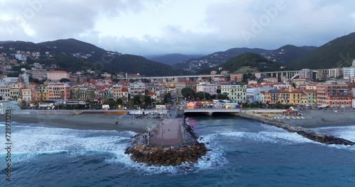 Breakwater at Varazze beach in Italy. Aerial drone backward view