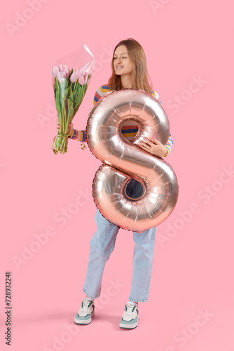Young woman with bouquet of...