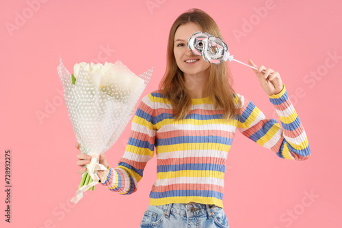 Young woman with bouquet of...