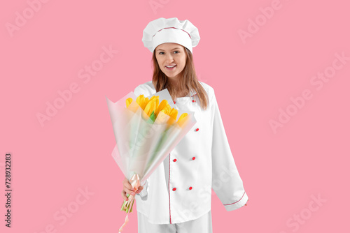 Young female chef with bouq...