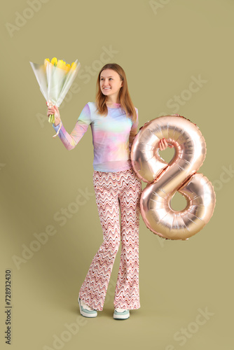 Young woman with bouquet of...