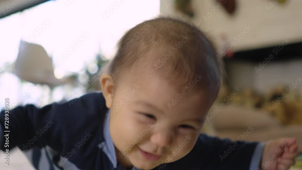 Cute infant baby doing tummy time on play mat Cute infant baby doing tummy time on play mat
