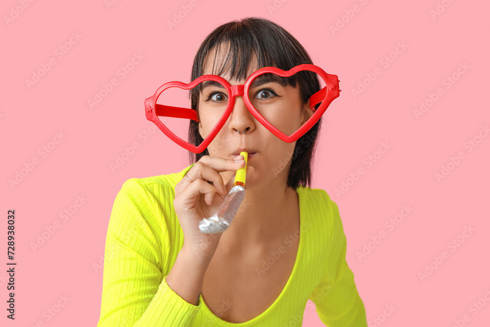 Beautiful young woman in funny disguise with party whistle on pink background. April Fools Day celebration Beautiful young woman in funny disguise with party whistle on pink background. April Fools Day celebration