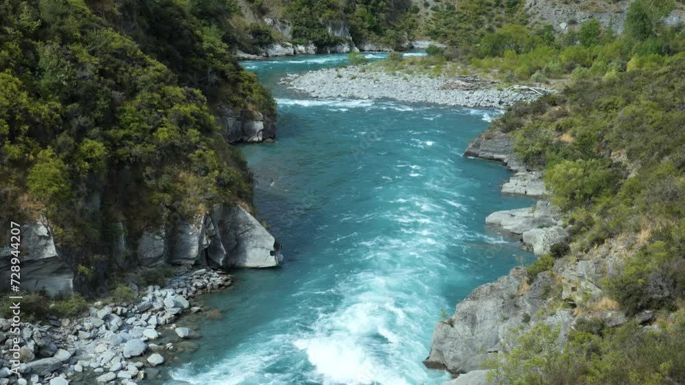 Kawaraw river flows between mountains at Roaring Meg, Queenstown, New Zealand, close-up Kawaraw river flows between mountains at Roaring Meg, Queenstown, New Zealand, close-up