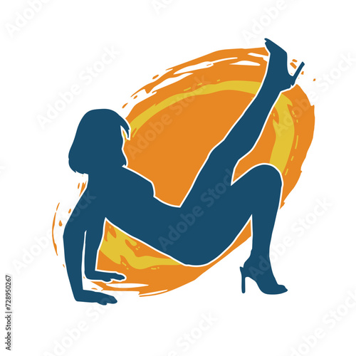 Silhouette of a sexy female doing seductive dance