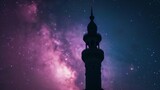 silhouette of an intricately designed tower or minaret against a mesmerizing backdrop of the starry night