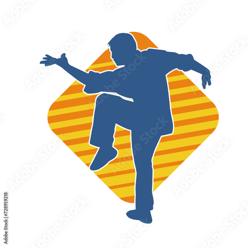 Silhouette of a man in oriental martial art pose. Silhouette of a male in martial art move.