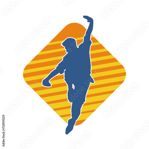 Silhouette of a man in oriental martial art pose. Silhouette of a male in martial art move.