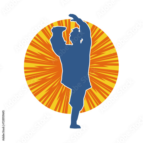 Silhouette of a man in oriental martial art pose. Silhouette of a male in martial art move.
