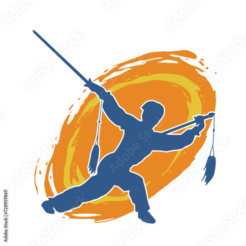 Silhouette of a kungfu or wushu martial art athlete in action pose. Silhouette of a male martial art person in pose with swords weapon.