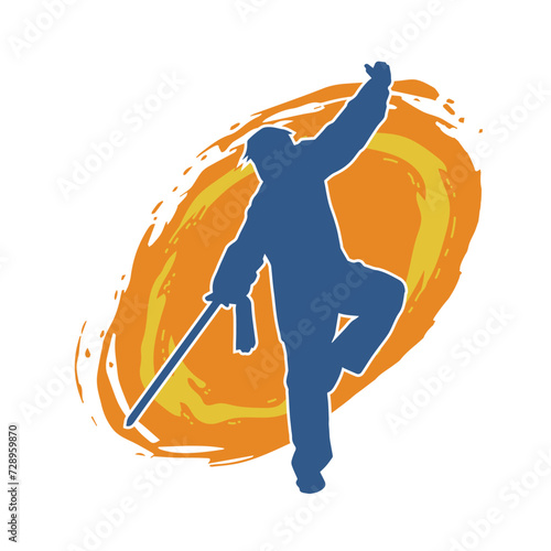 Silhouette of a kungfu or wushu martial art athlete in action pose. Silhouette of a male martial art person in pose with swords weapon.
