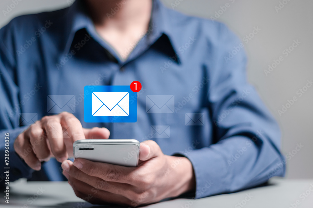 Email marketing concept. Person use smartphone with virtual email notification alert. Direct selling project in customer list business for email. Email marketing concept. Person use smartphone with virtual email notification alert. Direct selling project in customer list business for email.