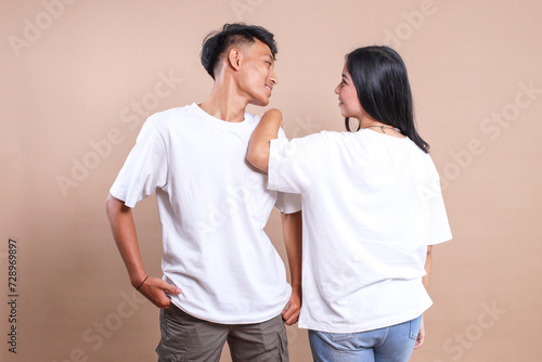 Asian man and woman couple wearing white t-shirt. Front and back t-shirt mockup for couple.
