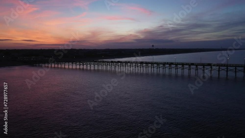 Wallpaper Mural Drone footage of sunrise behind a pier as the drone moves out to sea Torontodigital.ca