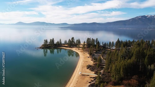 Aerial View of Sand Harbor Park and Lake Tahoe, Nevada USA, Pristine Landscape and Sky Mirror Reflection on Water photo