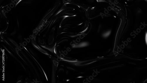Slow motion of a liquid black mixture of oil. photo