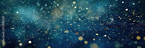 : a blue and gold background with stars. Suitable for celestial, festive, or glamorous design projects such as invitations, holiday-themed graphics.glitter lights. de focused. banner.bokeh blur circle © Planetz