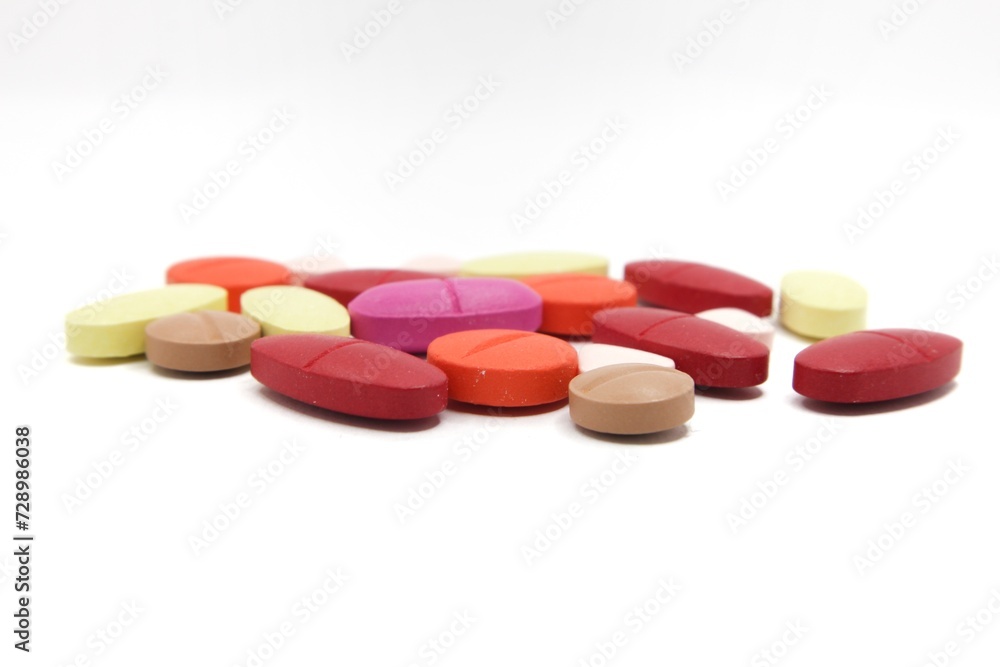 Detailed photos of oval, round and triangular shaped tablets in various colors: red, orange, yellow and cream. The photo was taken on a white background
Detailed photos of oval, round and triangular shaped tablets in various colors: red, orange, yellow and cream. The photo was taken on a white background