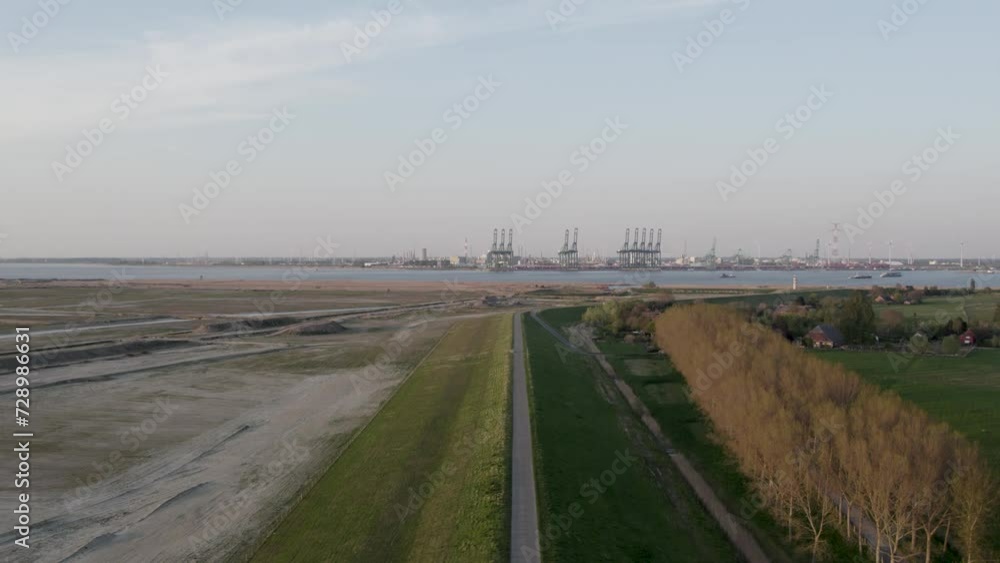 9th of june 2023, Antwerp, Belgium, Captured during the gentle hours of early evening, this stock footage provides an aerial view of the Port of Antwerp's vast industrial landscape as the day winds 9th of june 2023, Antwerp, Belgium, Captured during the gentle hours of early evening, this stock footage provides an aerial view of the Port of Antwerp's vast industrial landscape as the day winds