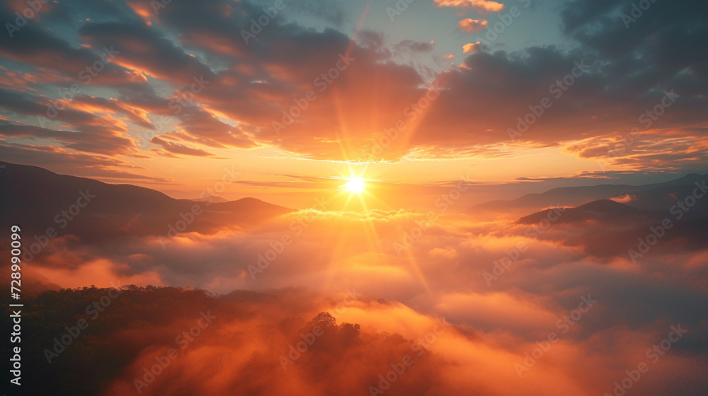 A serene sunrise over a misty mountain valley, with the first rays of light piercing through the fog - obrazy, fototapety, plakaty 