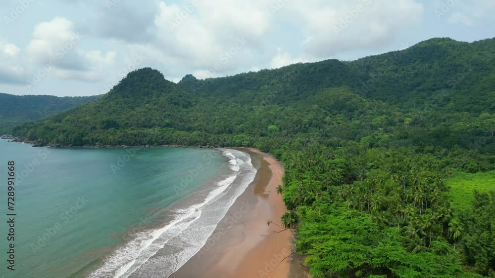 Amazing aerial view over Praia grande at South of São Tomé where we can apreciate the beautiful beach surronded by the Forest.Africa Amazing aerial view over Praia grande at South of São Tomé where we can apreciate the beautiful beach surronded by the Forest.Africa