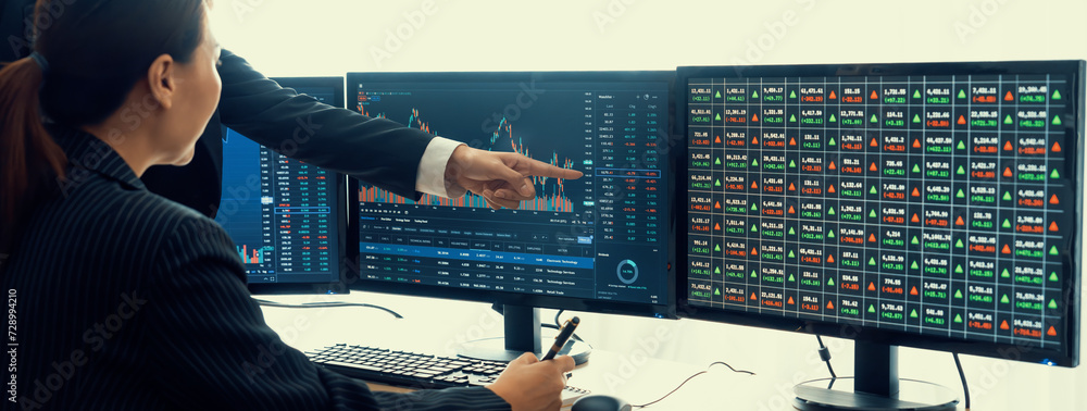 A cropped image of cooperate skilled business team discussion about stock investment while point the analysis stock chart. Show up and down trend. Stock market trading concept. Closeup. Burgeoning. - obrazy, fototapety, plakaty 