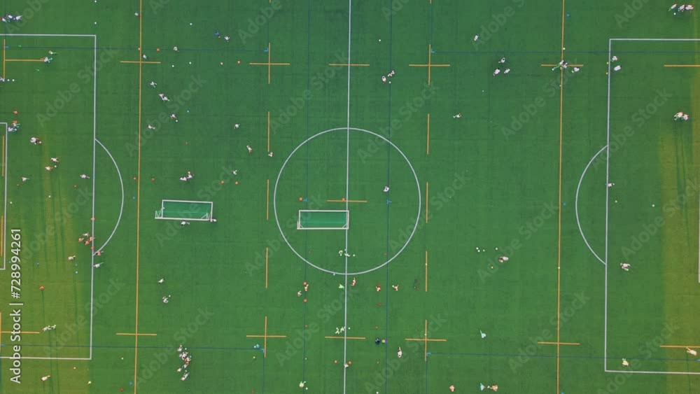 Top view green stadium under evening sunlight. Drone shot beautiful soccer field Top view green stadium under evening sunlight. Drone shot beautiful soccer field