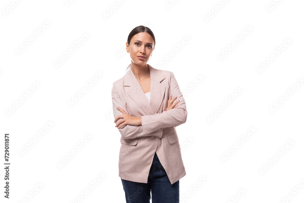 pretty slim young woman with black hair in a jacket on a white background with copy space pretty slim young woman with black hair in a jacket on a white background with copy space