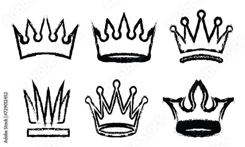 Set of crown icon in brush stroke. Thick paint in the form of a crown isolated on white background. Brush stroke texture paint style hand drawn illustration.