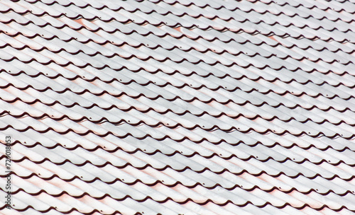 Metal tiles on the roof as an abstract background. Texture