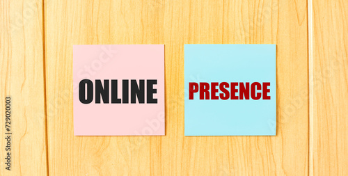 Inscription ONLINE PRESENCE on pink and blue square sticky sticker on wooden wall