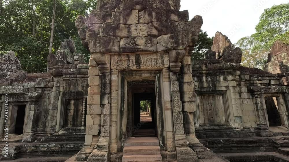 Journey through the labyrinthine Preah Khan temple, an emblem of Angkor era in Cambodia, where roots intertwine with ancient stones. Journey through the labyrinthine Preah Khan temple, an emblem of Angkor era in Cambodia, where roots intertwine with ancient stones.