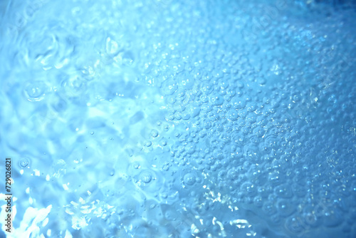 Blue water texture. Bubbles and bubbling water.