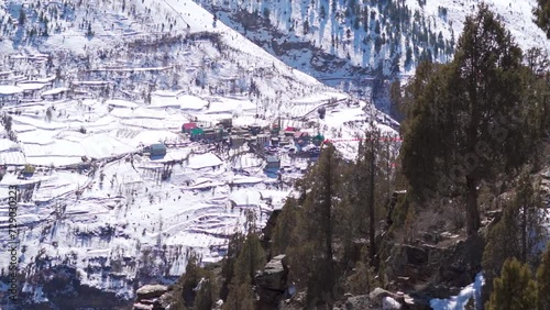 Snow covered Kardang village during the winter season after snowfall at Lahaul Valley in Himachal Pradesh, India. Beautiful village covered by snow in the Himalayas in winter. Nature background photo