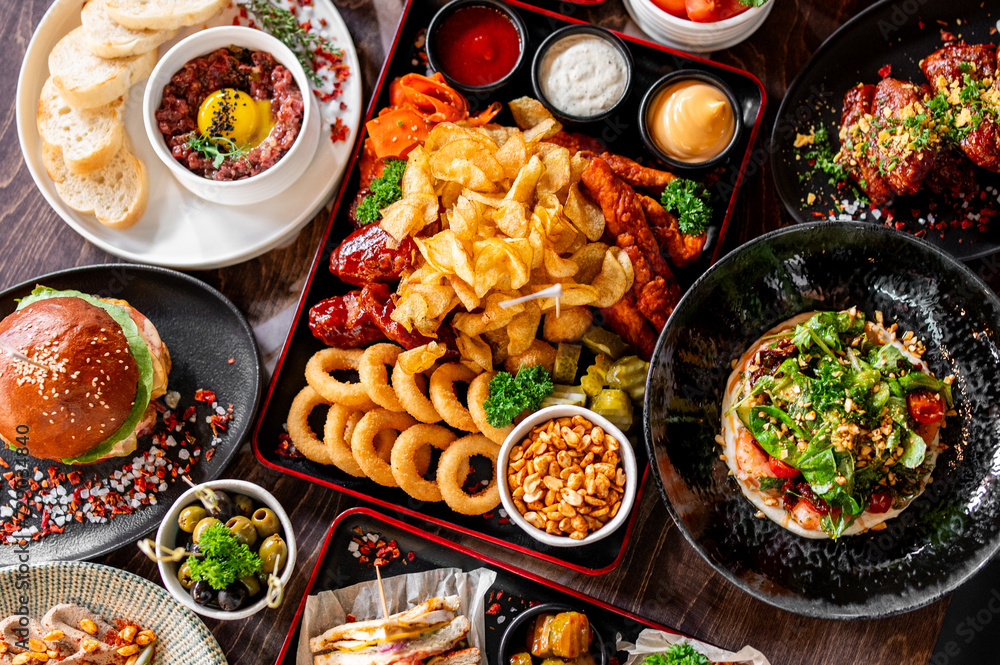 variety of restaurant food dishes on table. top view. variety of restaurant food dishes on table. top view.