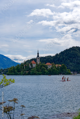 Wallpaper Mural Lake Bled with church on an island and woodland in the background on a cloudy summer day. Photo taken August 8th, 2023, Bled, Slovenia. Torontodigital.ca