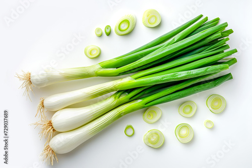 Top view of group of green scallions and circle slices with shadows photo