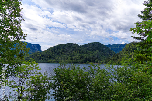 Lake Bled with woodland and mountain panorama in the background on a cloudy summer day. Photo taken August 8th  2023  Bled  Slovenia.