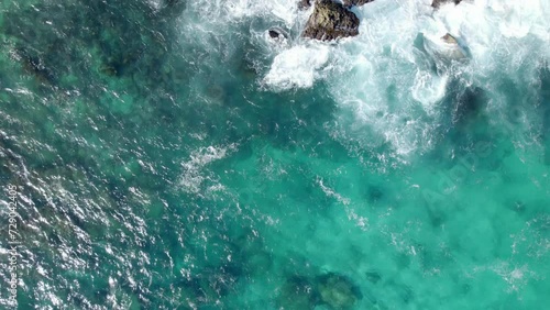 Crystal Clear With Foamy Waves On The Rock Shore Of Porte d'Enfer, Caribbean Sea, Guadeloupe, France. Aerial Topdown Shot  photo