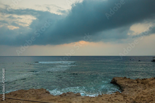Fototapeta Naklejka Na Ścianę i Meble -  dark stormy rain clouds at the beach in egypt