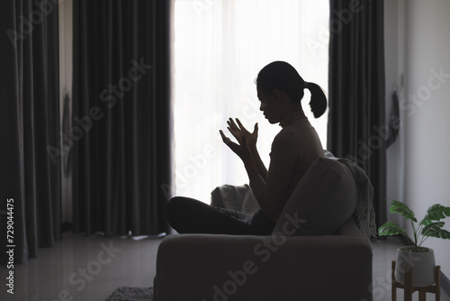 Silhouette of a person praying to god and holy things, religious concept, faith and belief, religious.