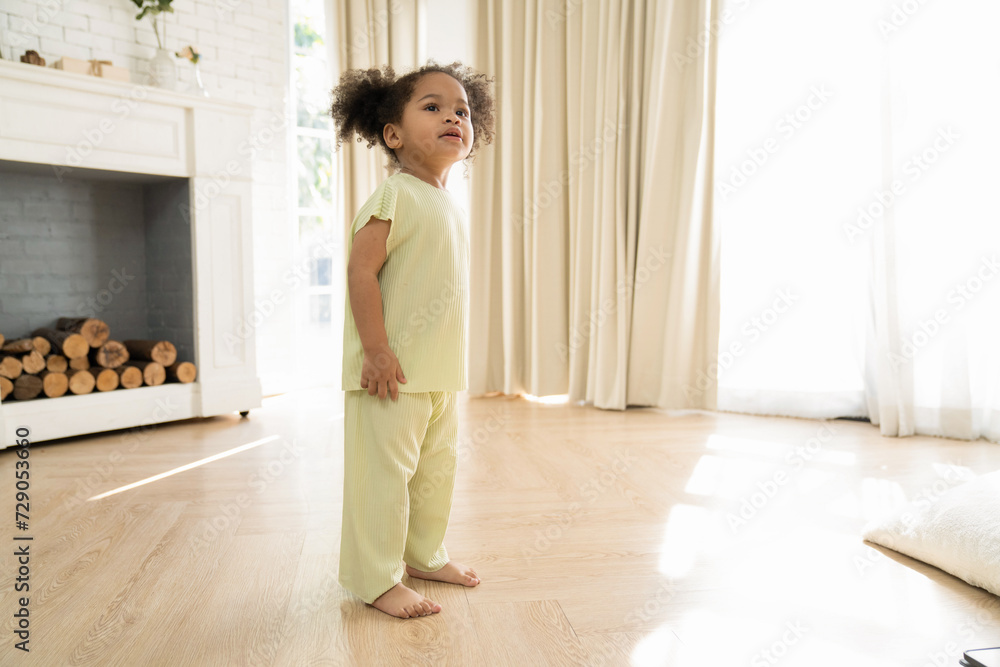 Little African American girl playing freedom at home. the child playing high-quality photo Little African American girl playing freedom at home. the child playing high-quality photo