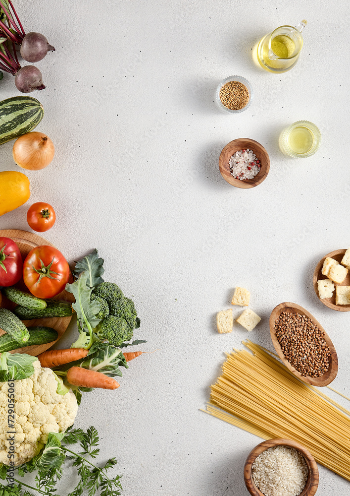 Overhead food background with fresh vegetables and pantry staples, offering ample copy space for text and design Overhead food background with fresh vegetables and pantry staples, offering ample copy space for text and design