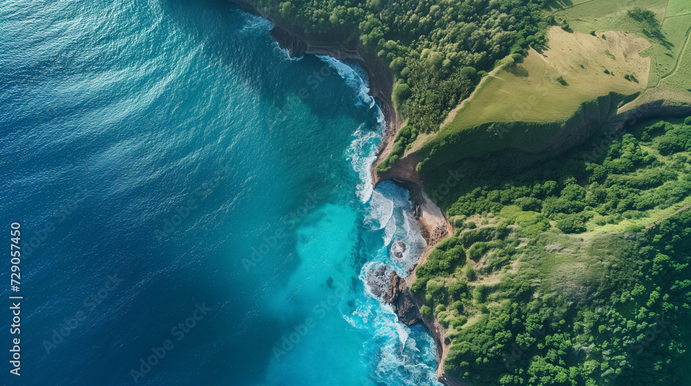Aerial view of a cliffside meeting turquoise waters.